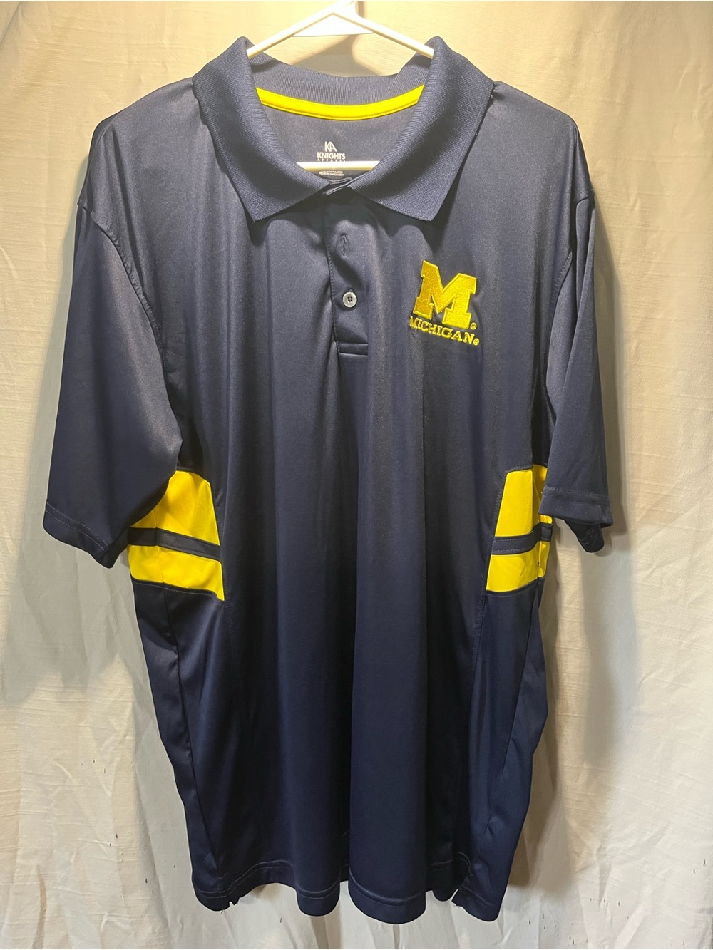 Knights Apparel Navy Polo with Yellow Accents and Michigan Logo